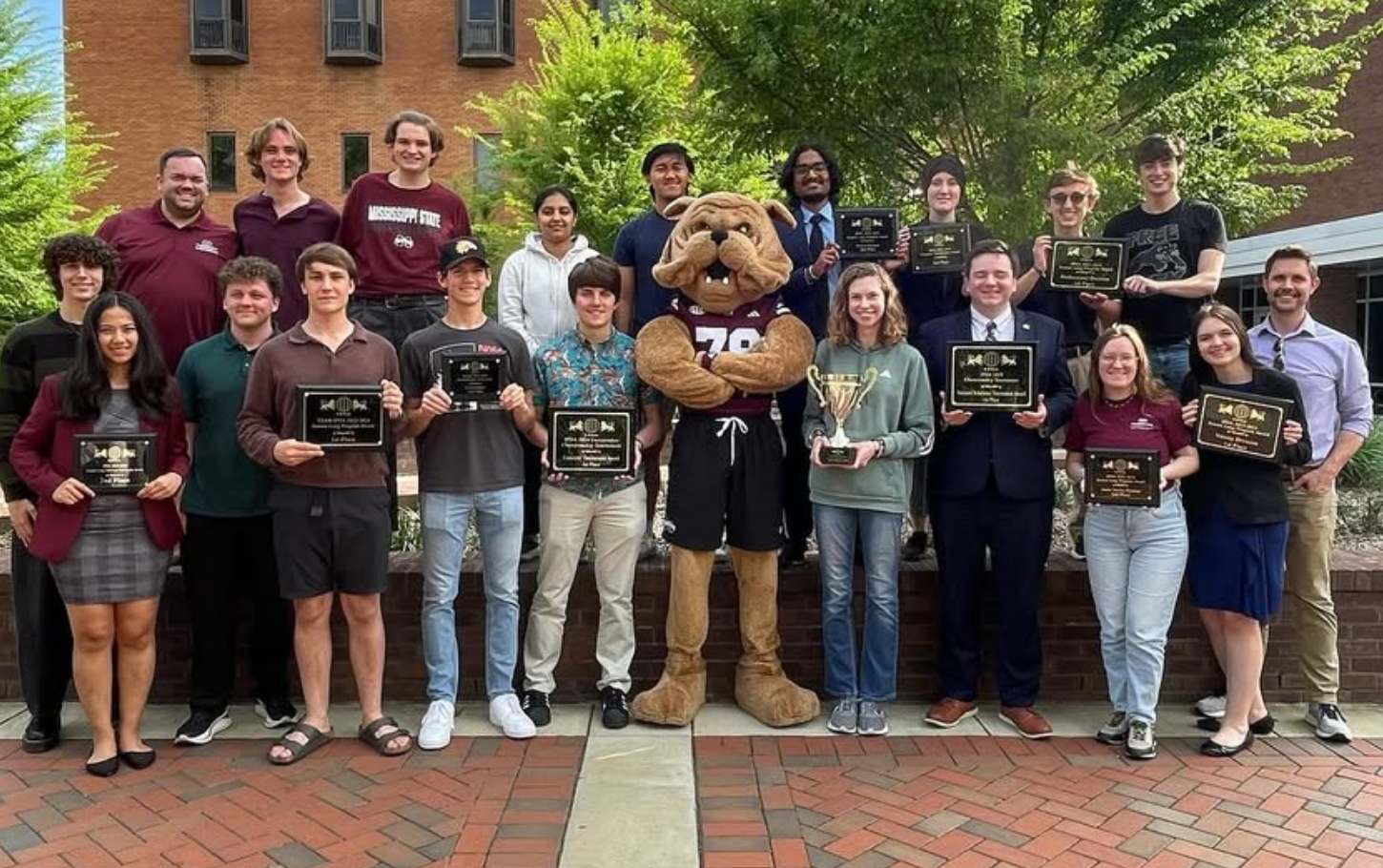 The MSU debate team displays awards after their 2024 national championship win.