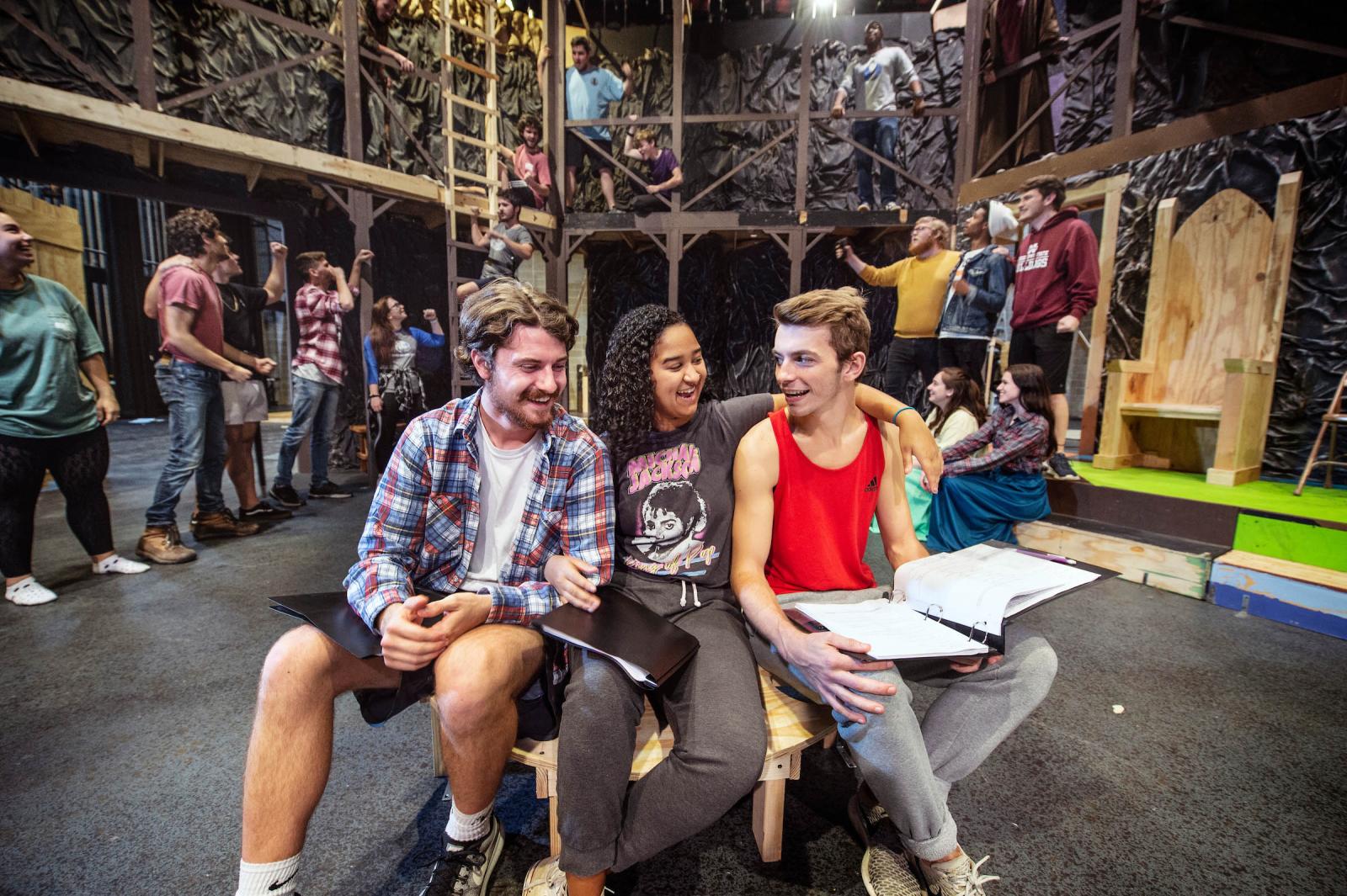 3 students talk backstage of Theatre production Beowulf