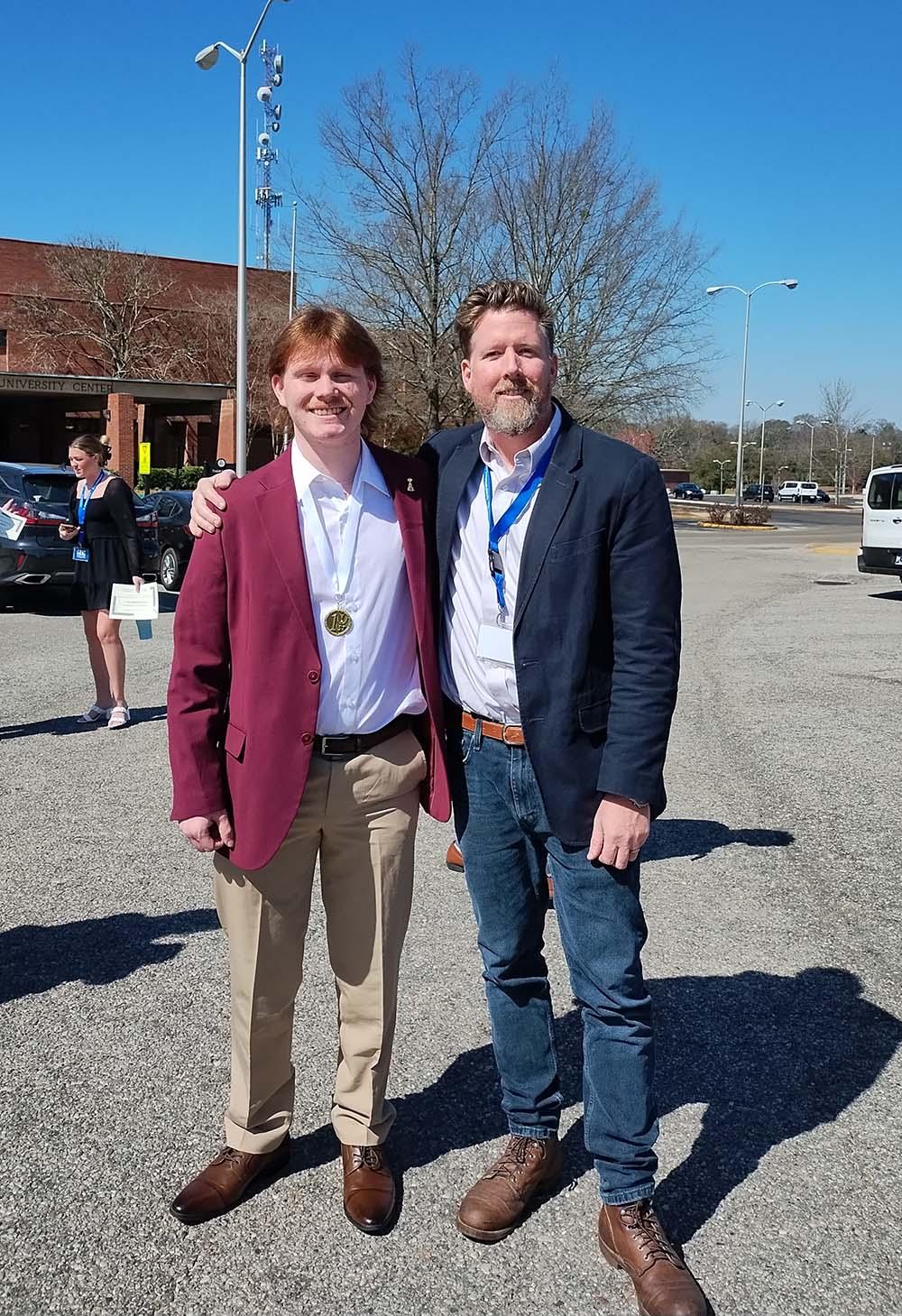 Reflector Editor-in-Chief Joshua Britt, pictured here with Reflector advisor Josh Foreman, won 1st place in “Page Design” at the Onsite competition. 