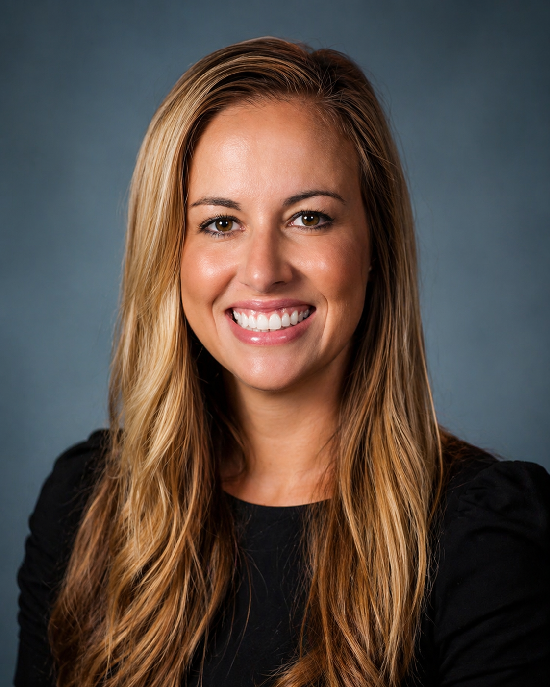 Heather Gholson, an instructor in communication, smiles at the camera.